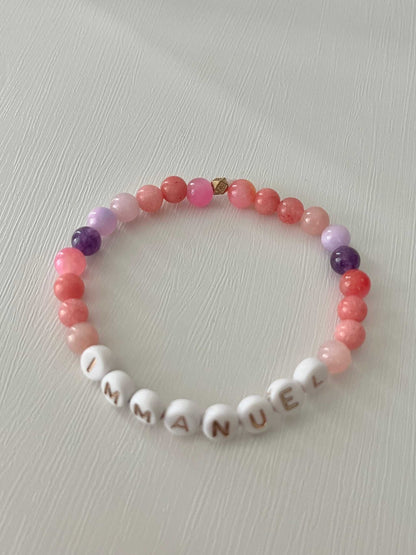 Pink purple IMMANUEL stone beaded braPink Purple IMMANUEL Bracelet showcasing vibrant pink and purple beads, ideal for expressing faith and style in your jewelry collection.celet