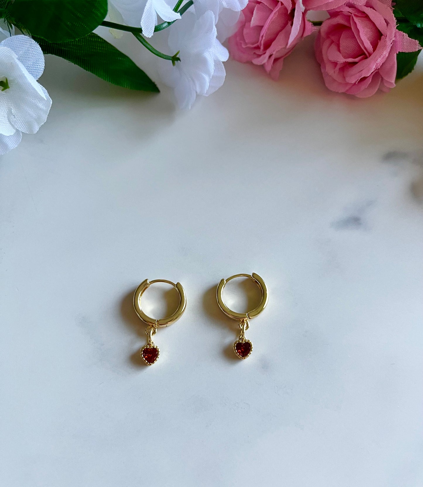 Gold heart huggie hoop earrings with dainty gold-filled heart charms, handmade jewelry for women.