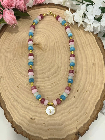 Christian cross necklace with colorful stone beads, gold accents, and pearlescent cross charm