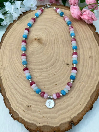 Christian cross necklace with colorful stone beads, silver accents, and pearlescent cross charm