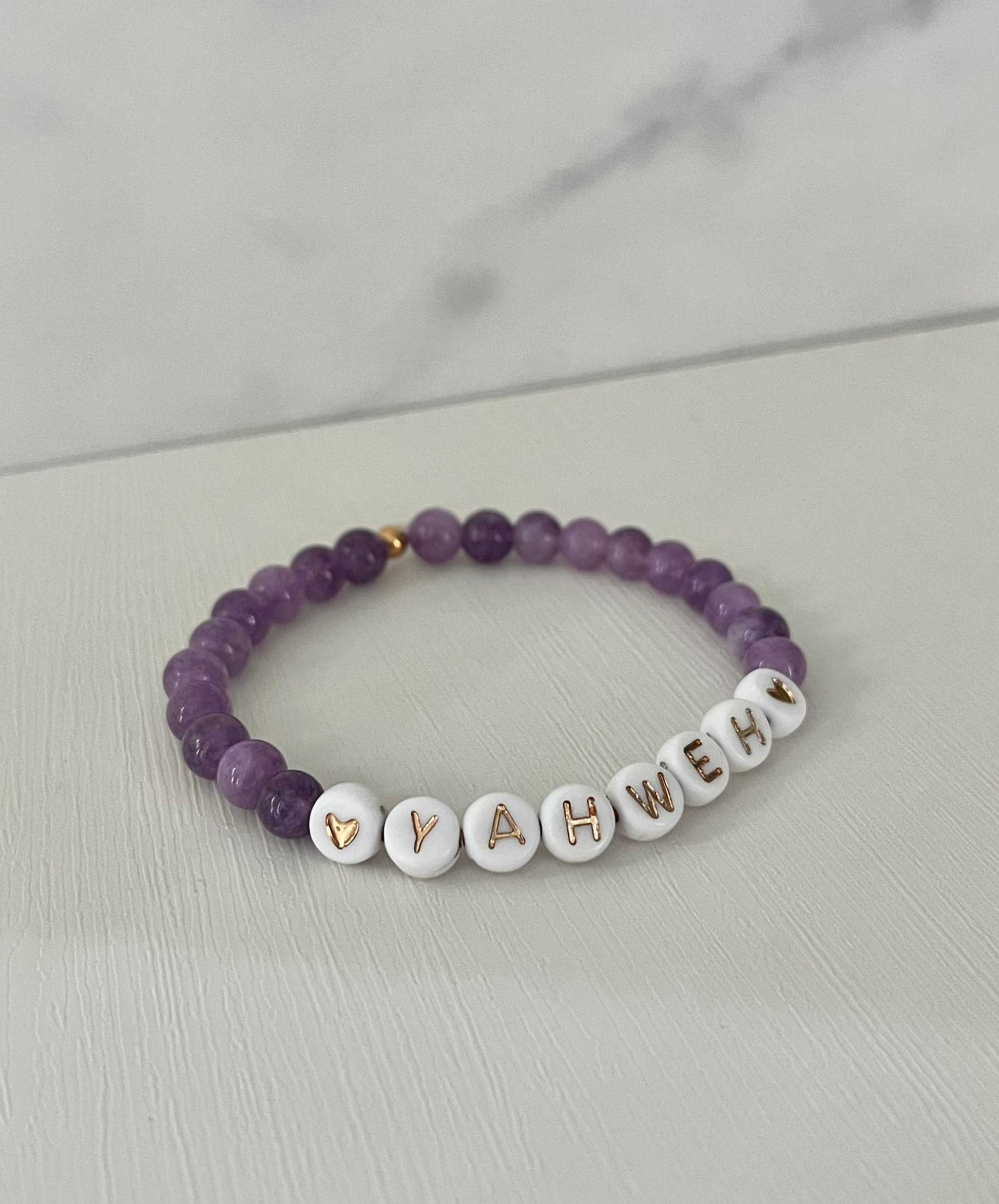 YAHWEH Pink Purple Marble Bracelet showcasing vibrant marble stones, ideal for expressing faith and adding a colorful touch to your jewelry collection.