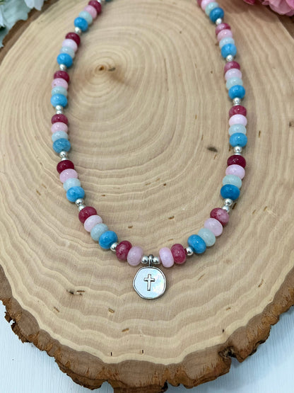 Christian cross necklace with colorful stone beads, silver accents, and pearlescent cross charm