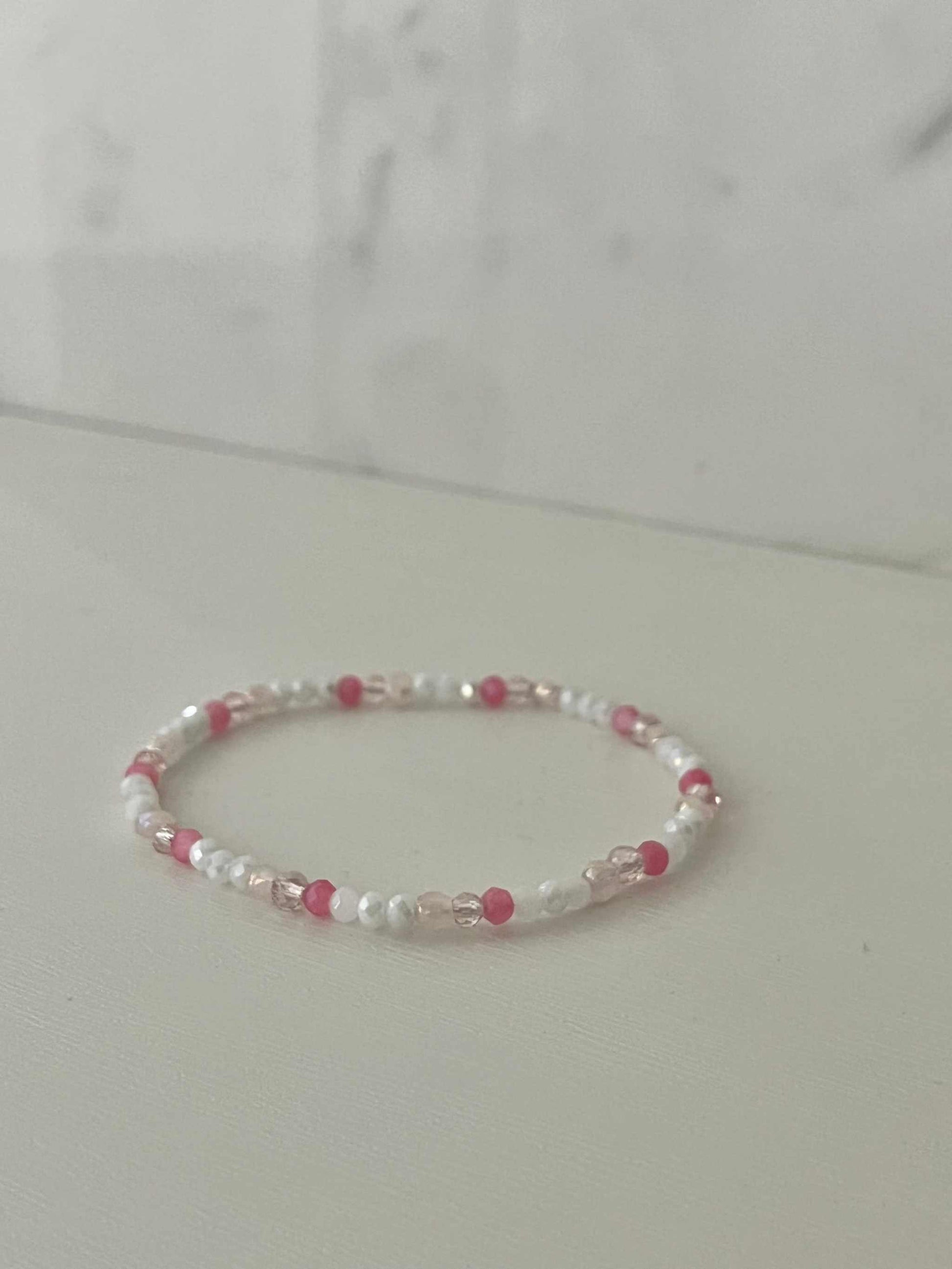 Dainty pink white jeweled crystal bracePink White Crystal Dainty Bracelet featuring delicate jeweled crystals, perfect for adding a touch of elegance to any outfit.let