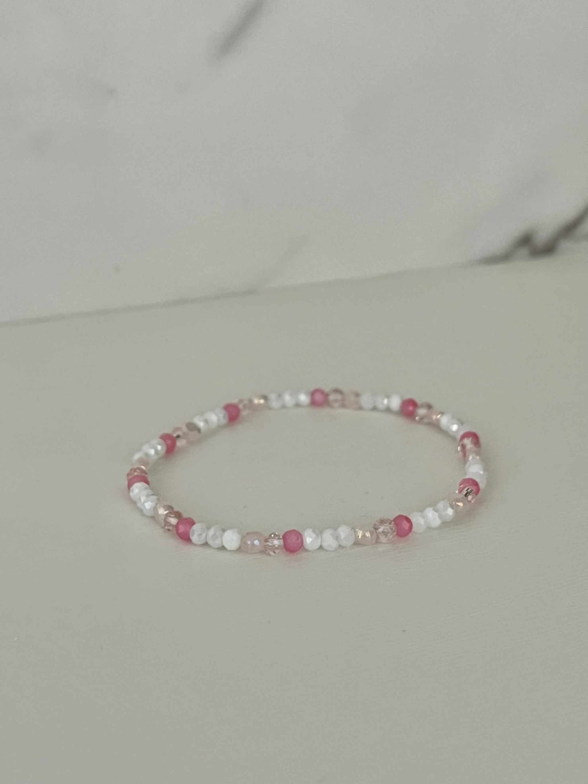 Dainty pink white jeweled crystal bracPink White Crystal Dainty Bracelet featuring delicate jeweled crystals, perfect for adding a touch of elegance to any outfit.elet