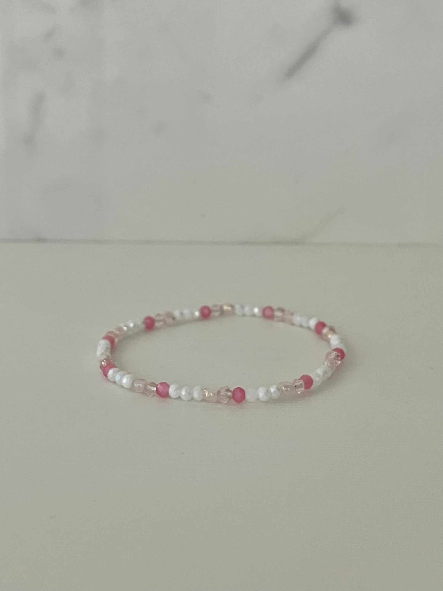 Dainty pink white jeweled crystal bracePink White Crystal Dainty Bracelet featuring delicate jeweled crystals, perfect for adding a touch of elegance to any outfit.let