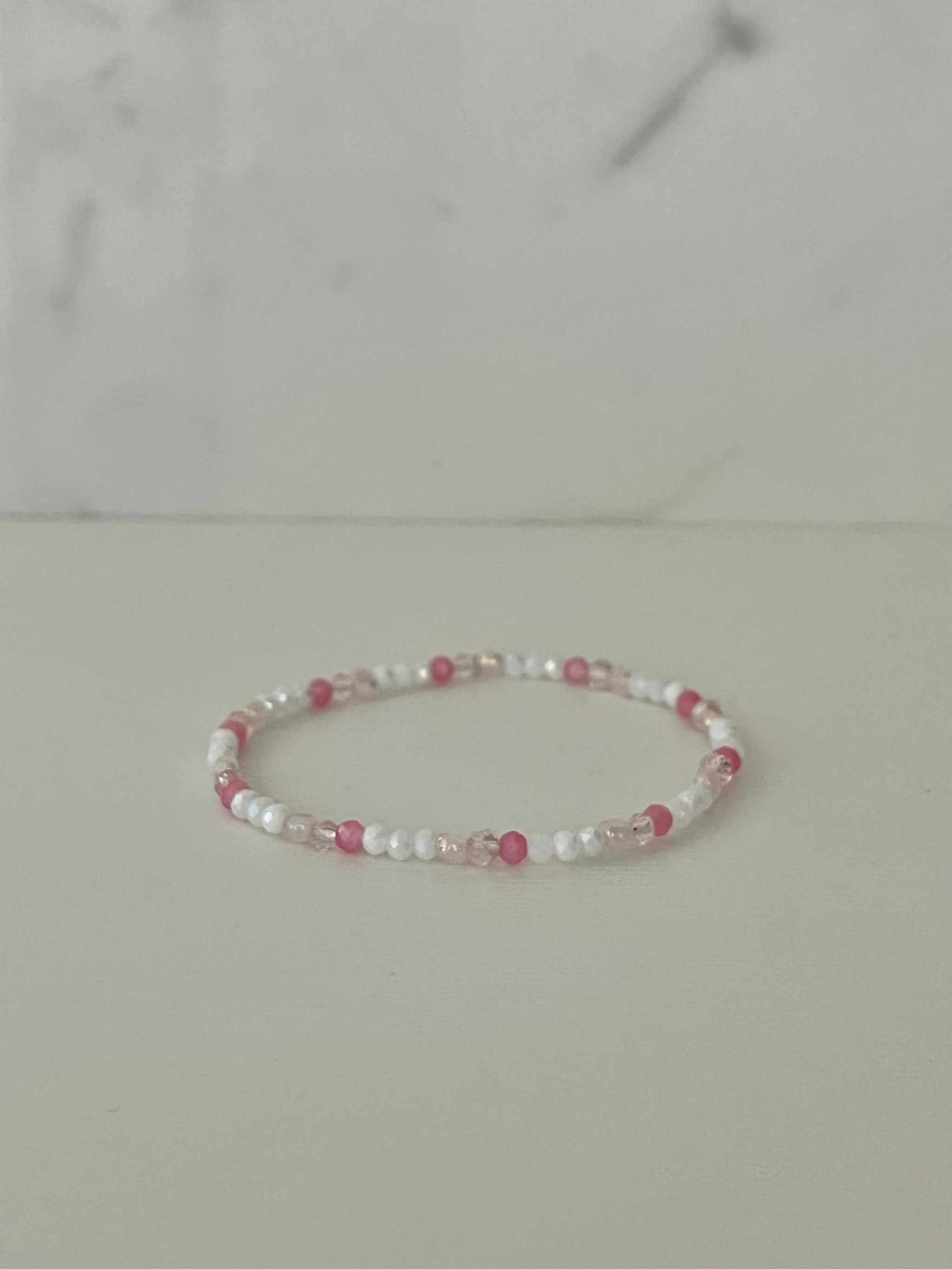 Dainty pink white jeweled crystal bracePink White Crystal Dainty Bracelet featuring delicate jeweled crystals, perfect for adding a touch of elegance to any outfit.let