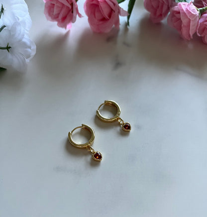 Gold heart huggie hoop earrings with dainty gold-filled heart charms, handmade jewelry for women.