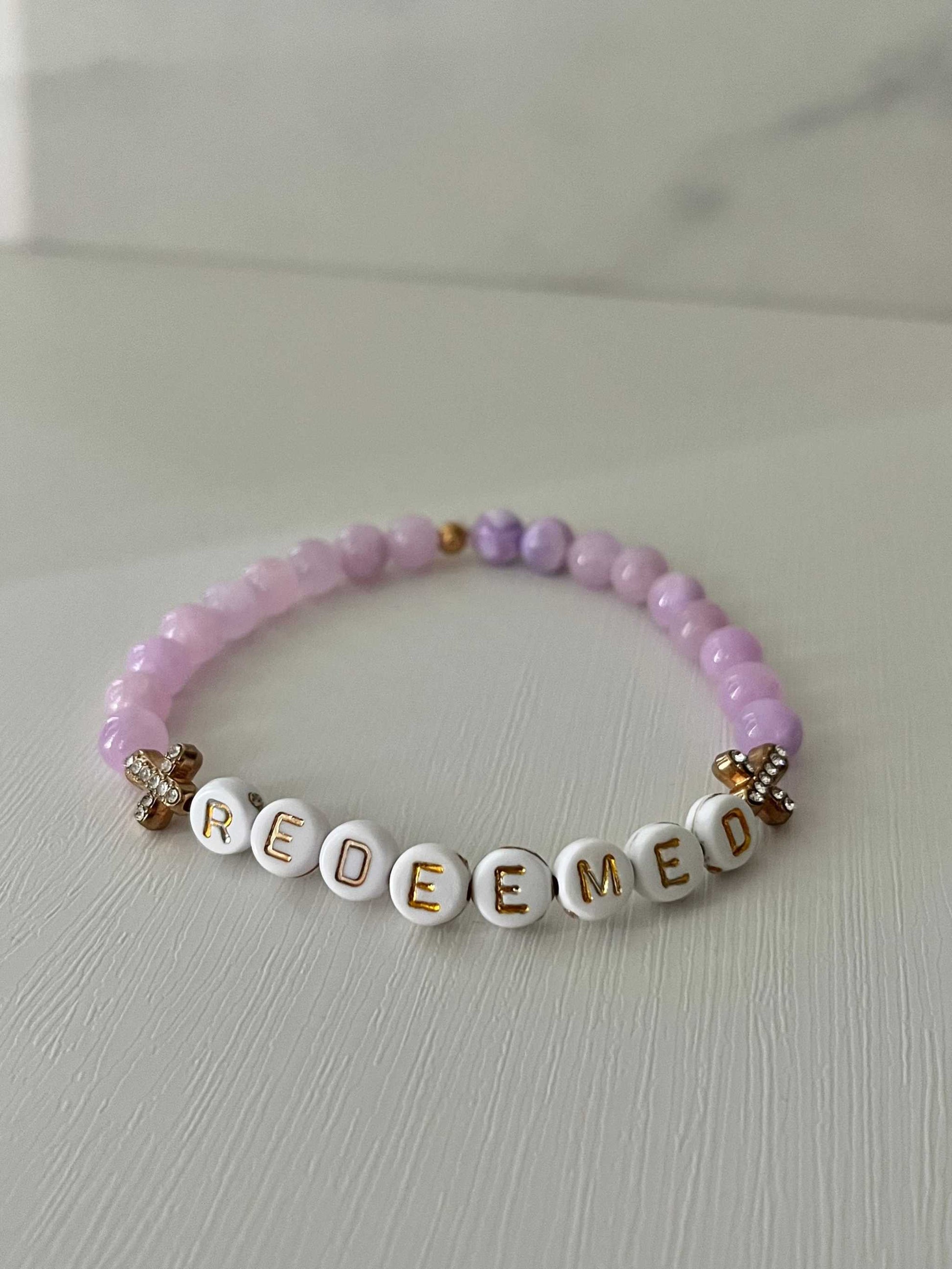 Redeemed Lavender Bead Bracelet – elegant faith jewelry with lavender glass stones.

