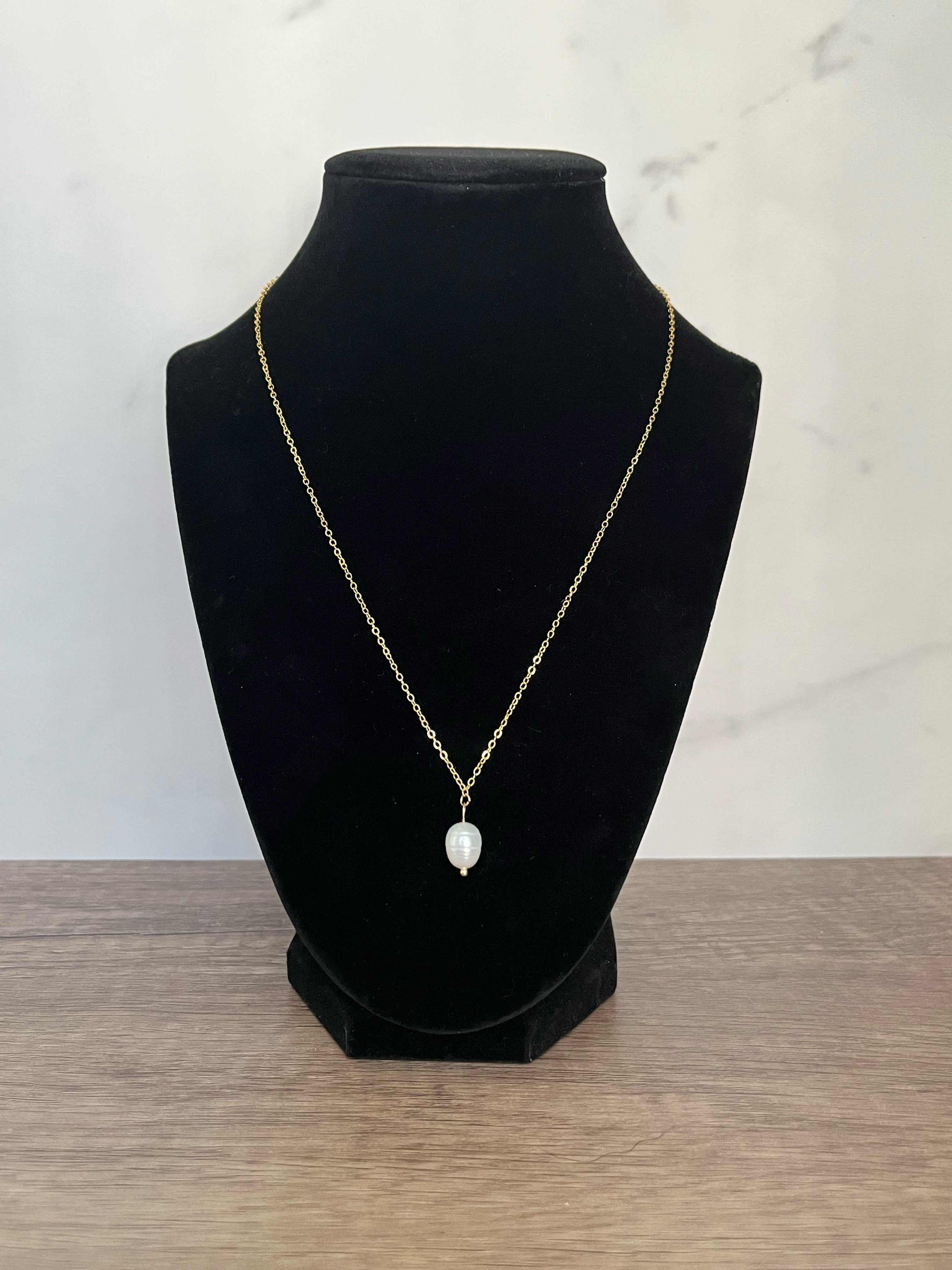 Gold necklace with pearl pendant, inspired by Proverbs 31 for Christian women.