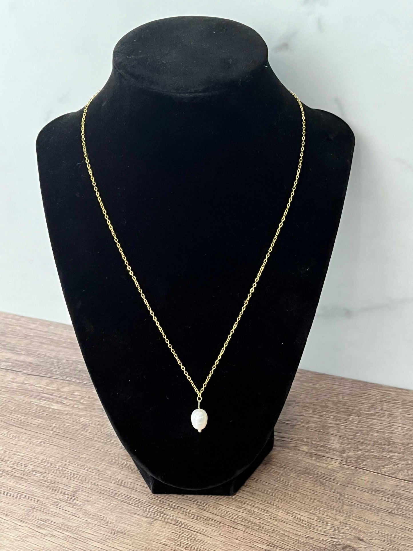 Gold necklace with pearl pendant, inspired by Proverbs 31 for Christian women.