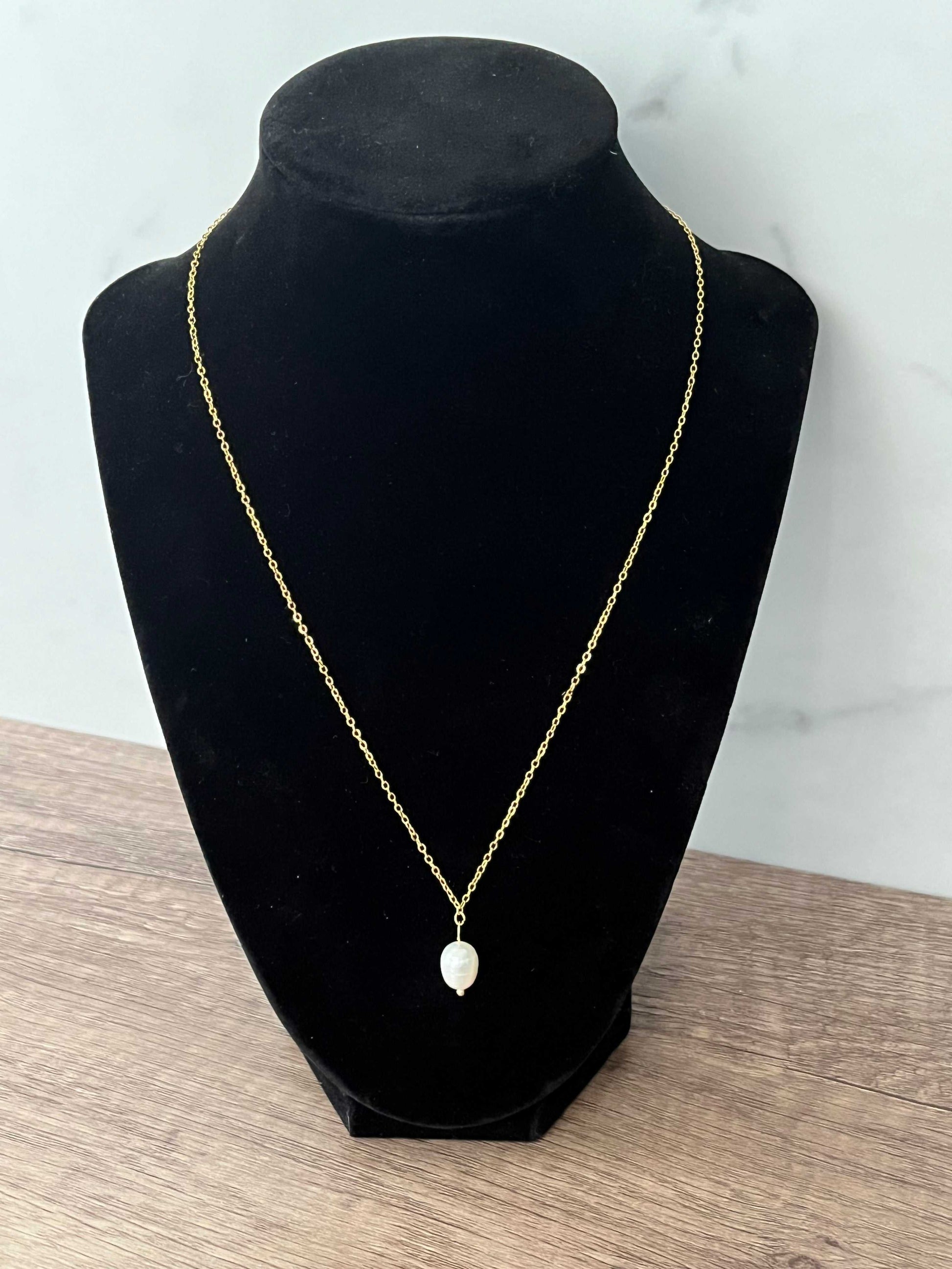 Gold necklace with pearl pendant, inspired by Proverbs 31 for Christian women.