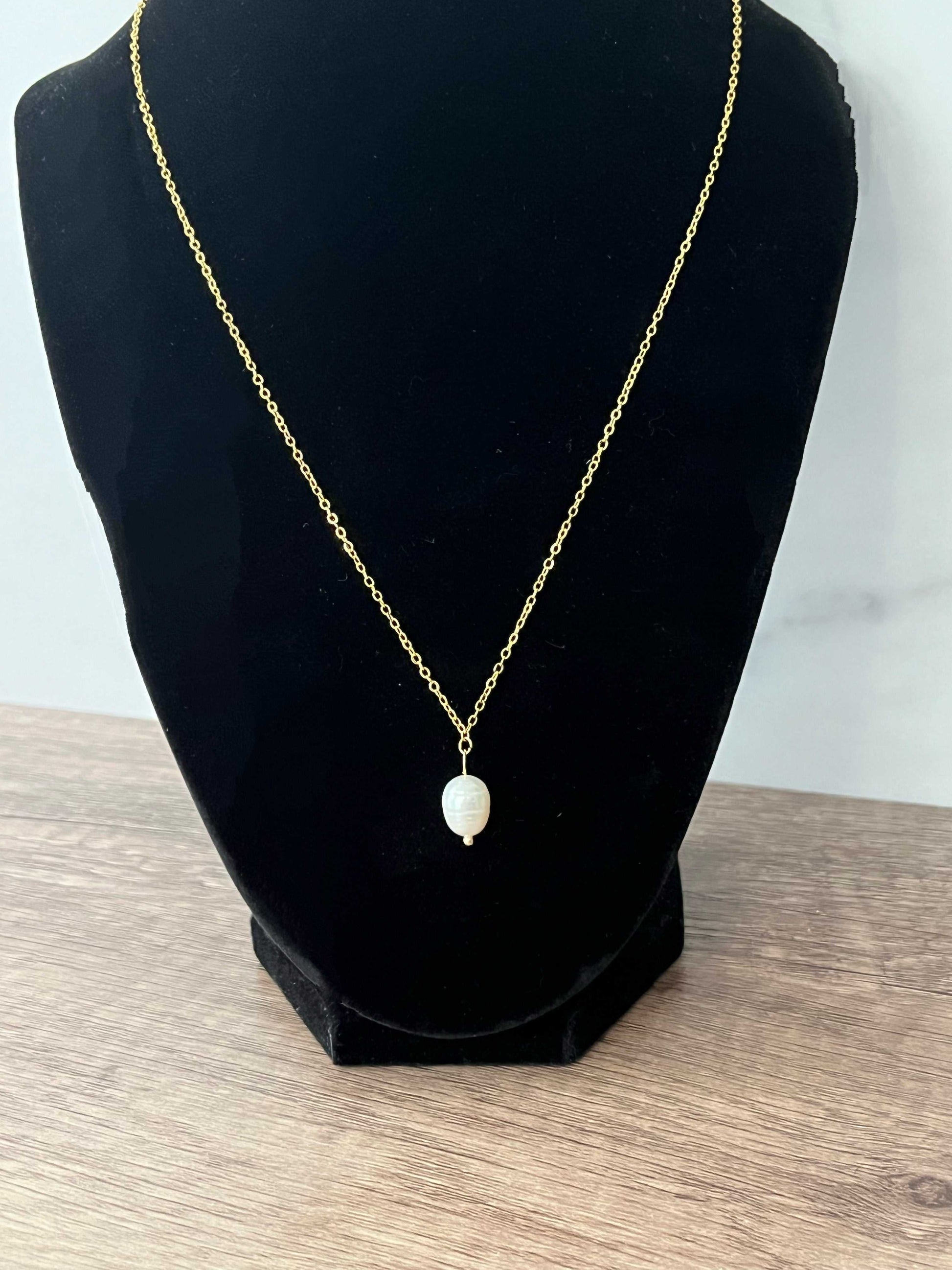 Gold necklace with pearl pendant, inspired by Proverbs 31 for Christian women.