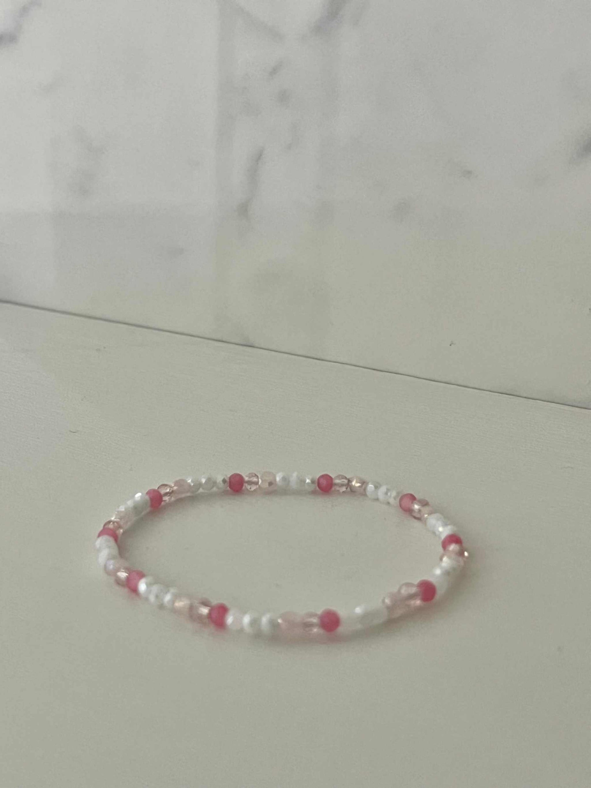 Dainty pink white jeweled crystal bracePink White Crystal Dainty Bracelet featuring delicate jeweled crystals, perfect for adding a touch of elegance to any outfit.let