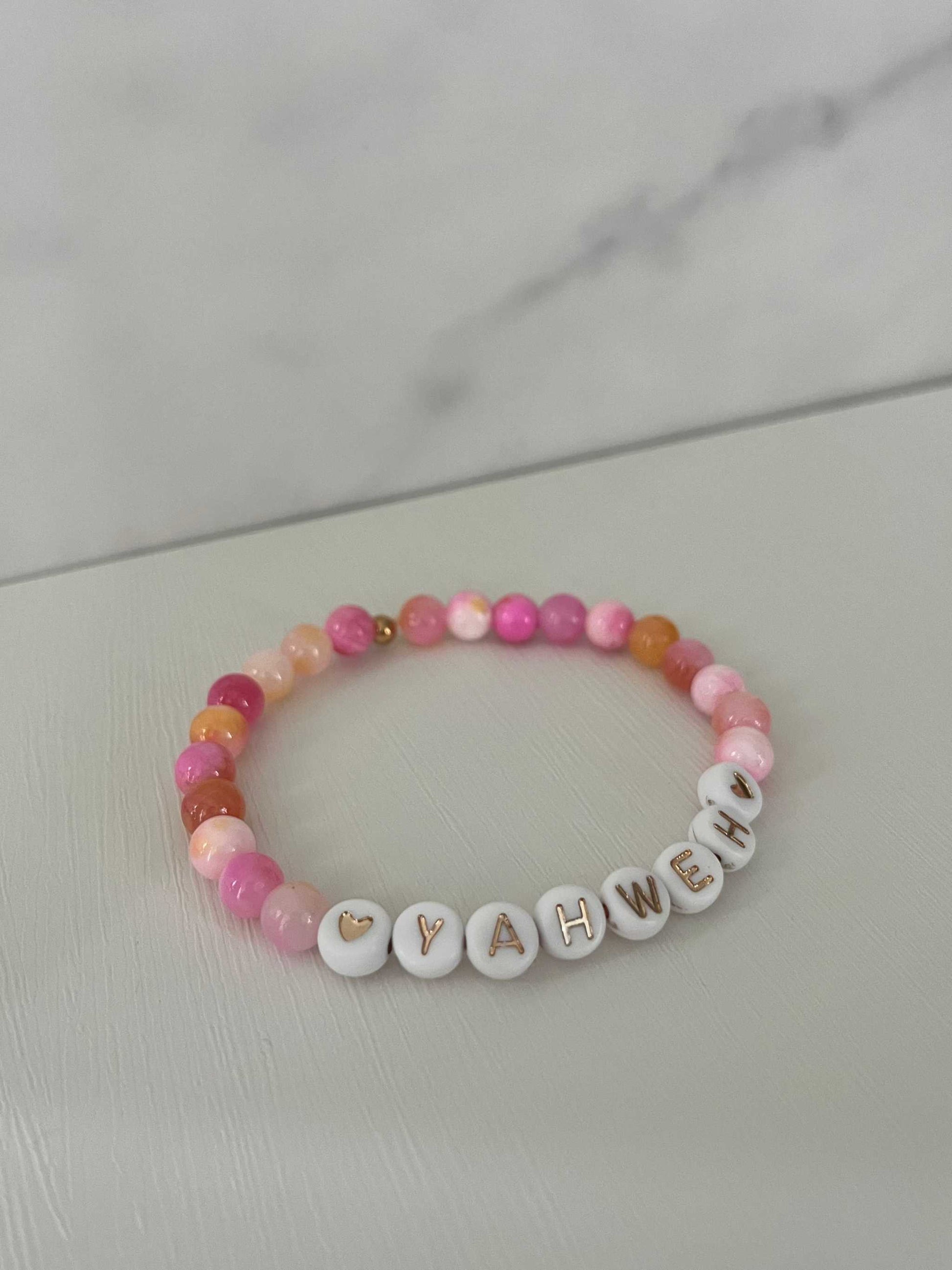 YAHWEH Pink Purple Marble Bracelet showcasing vibrant marble stones, ideal for expressing faith and adding a colorful touch to your jewelry collection.