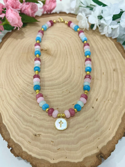Christian cross necklace with colorful stone beads, gold accents, and pearlescent cross charm