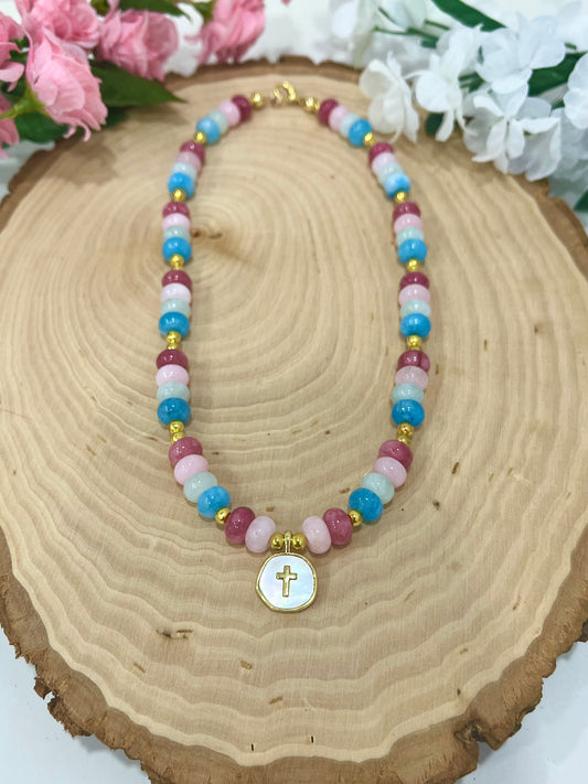 Christian cross necklace with colorful stone beads, gold accents, and pearlescent cross charm