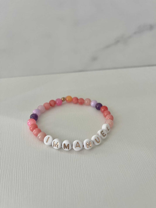 Pink purple IMMANUPink Purple IMMANUEL Bracelet showcasing vibrant pink and purple beads, ideal for expressing faith and style in your jewelry collection.EL stone beaded bracelet