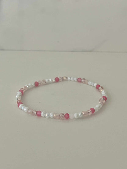 Dainty pink white jeweled crystal bracPink White Crystal Dainty Bracelet featuring delicate jeweled crystals, perfect for adding a touch of elegance to any outfit.elet