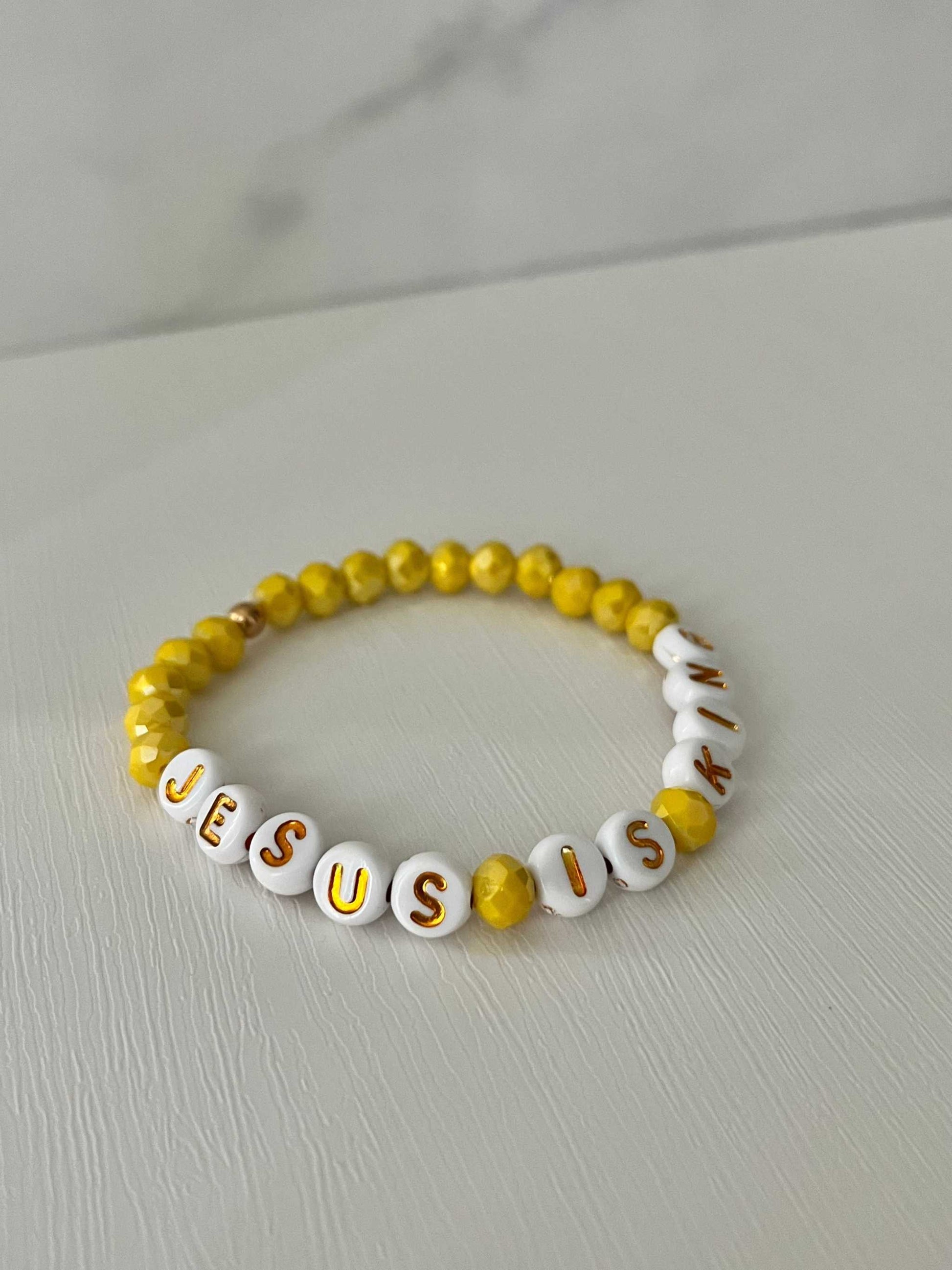 Jesus Is King bead bracelet – vibrant yellow faith-inspired jewelry.


