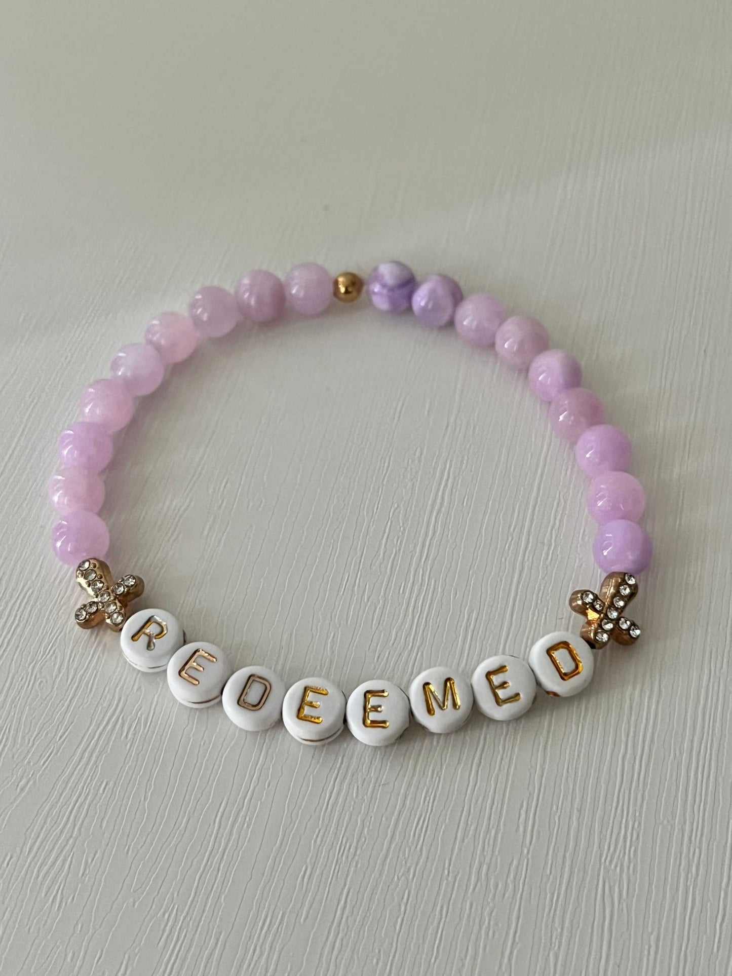 Redeemed Lavender Bead Bracelet – elegant faith jewelry with lavender glass stones.


