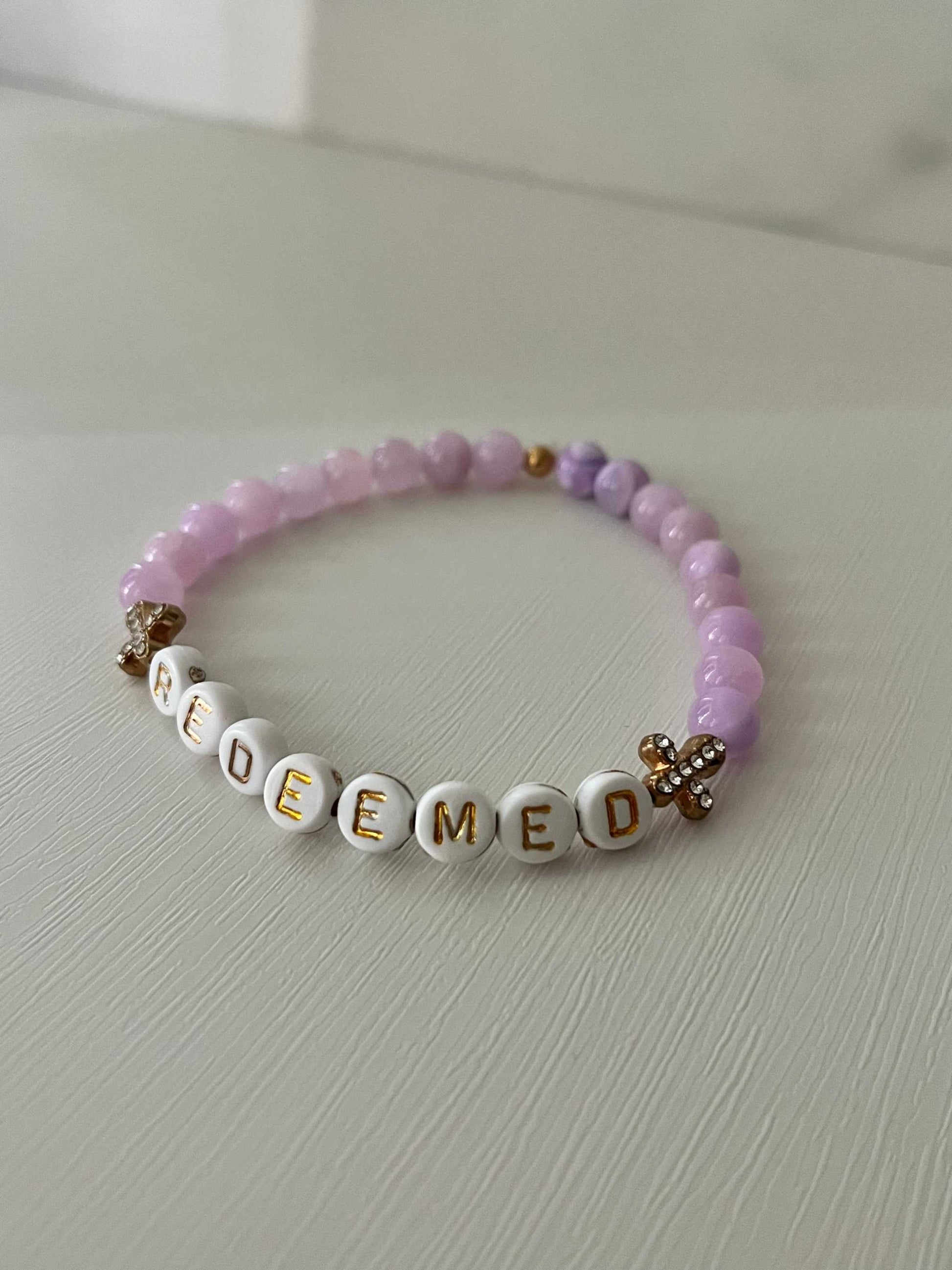 Redeemed Lavender Bead Bracelet – elegant faith jewelry with lavender glass stones.

