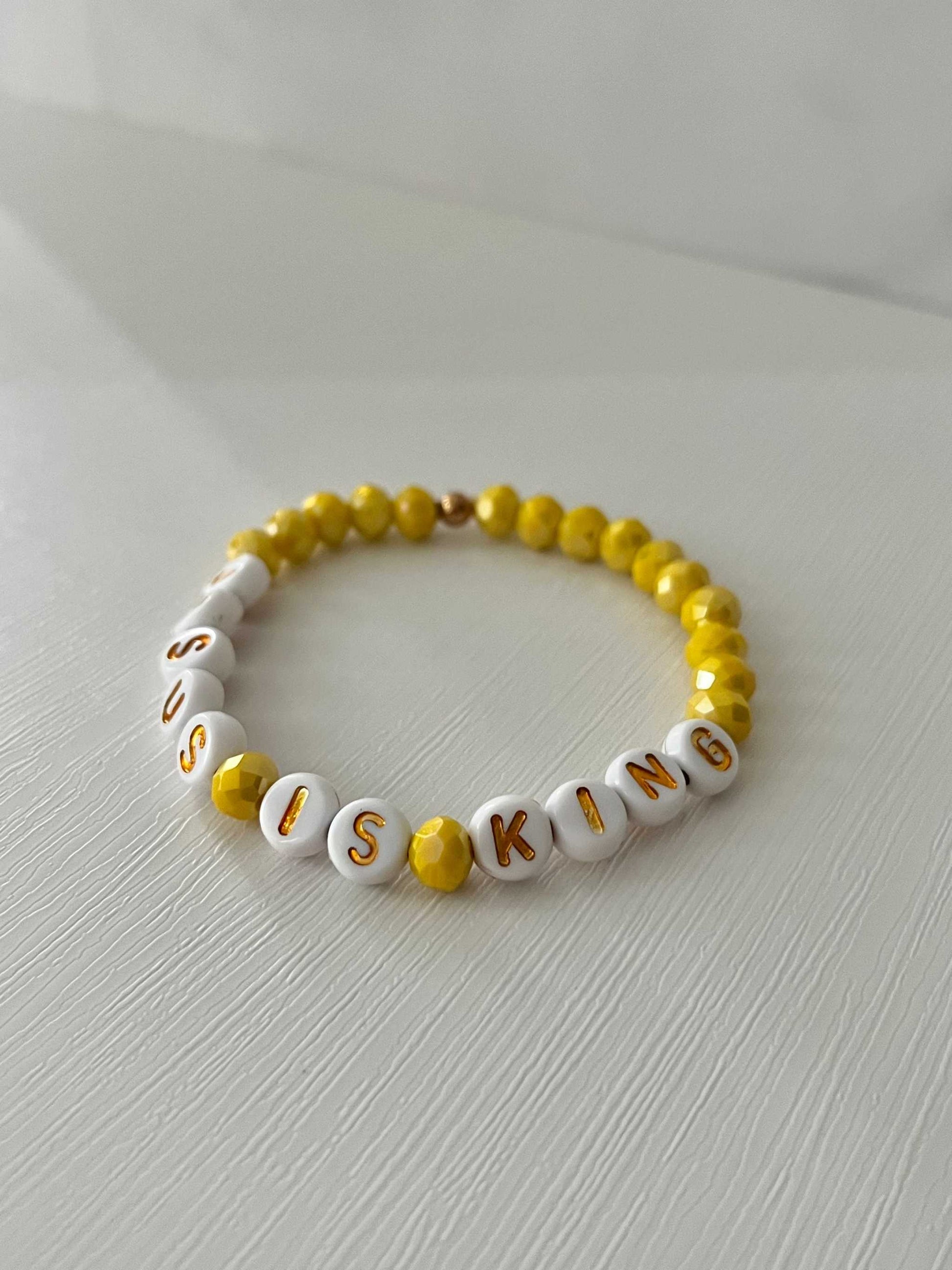 Jesus Is King bead bracelet – vibrant yellow faith-inspired jewelry.

