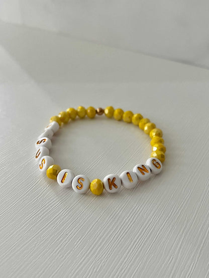 Jesus Is King bead bracelet – vibrant yellow faith-inspired jewelry.

