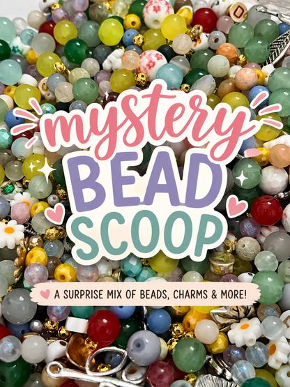 Colorful mystery bead scoop with assorted beads, charms, spacers and jewelry making supplies