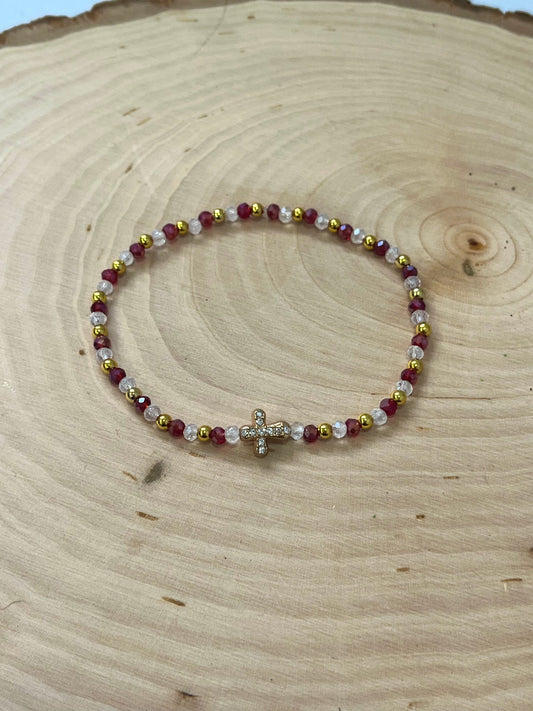 Christmas cross bracelet with red and green crystal beads and gold cross charm.