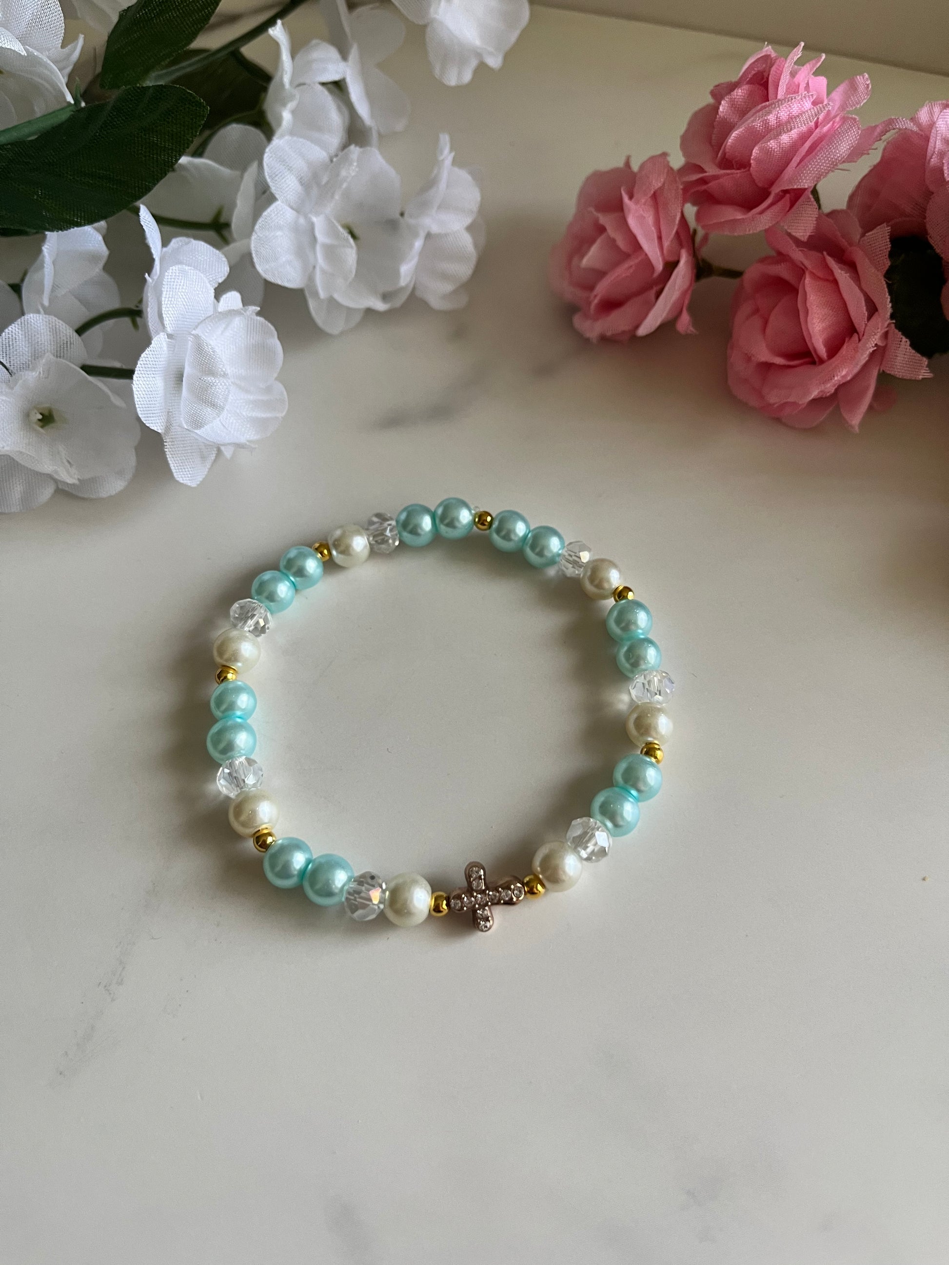 Pearl cross bracelet with gold charm and faux pearl beads
