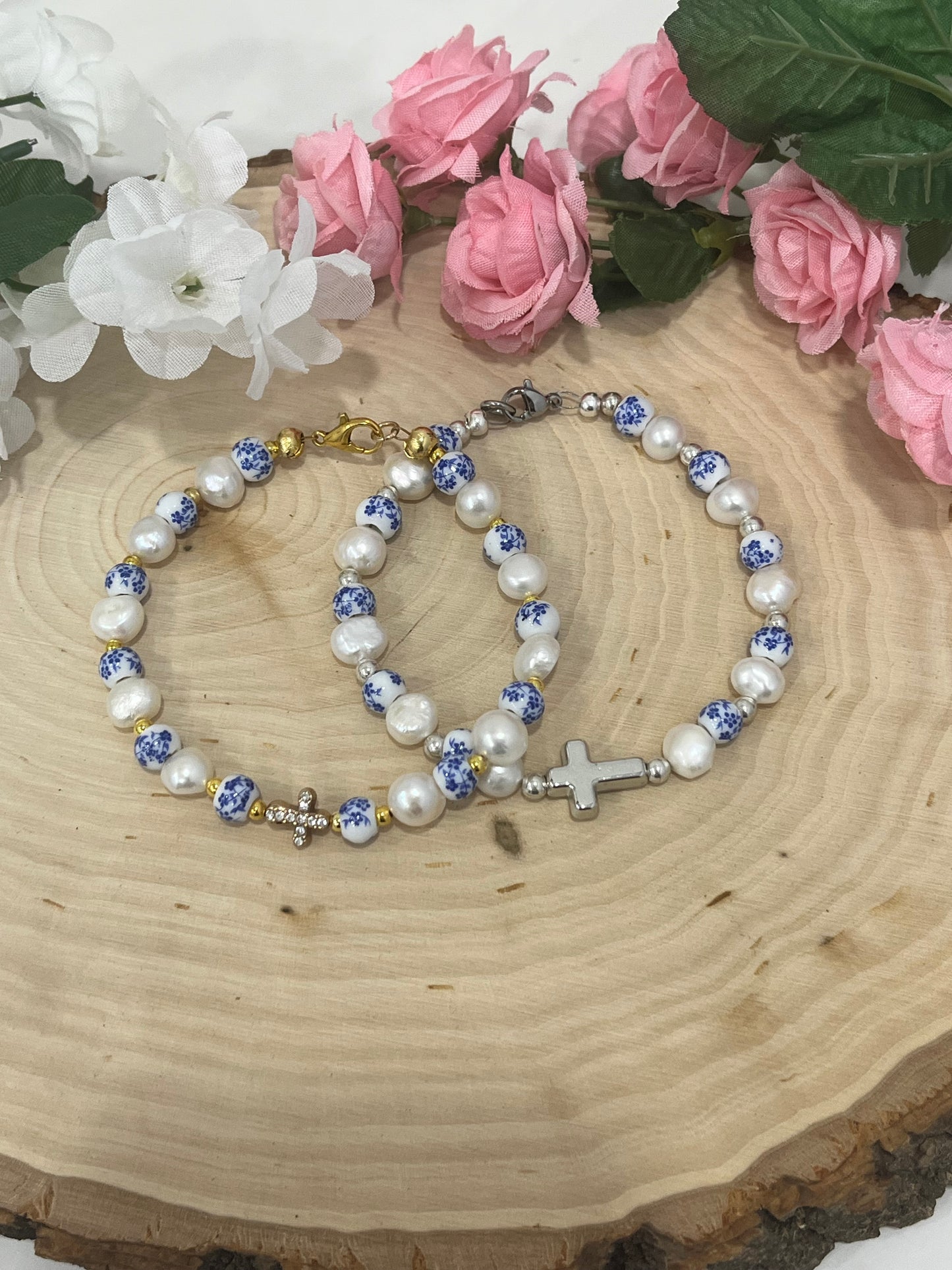 Handmade floral pearl cross bead bracelet with freshwater pearls and cross charm.