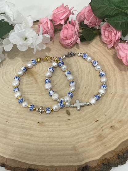 Handmade floral pearl cross bead bracelet with freshwater pearls and cross charm.