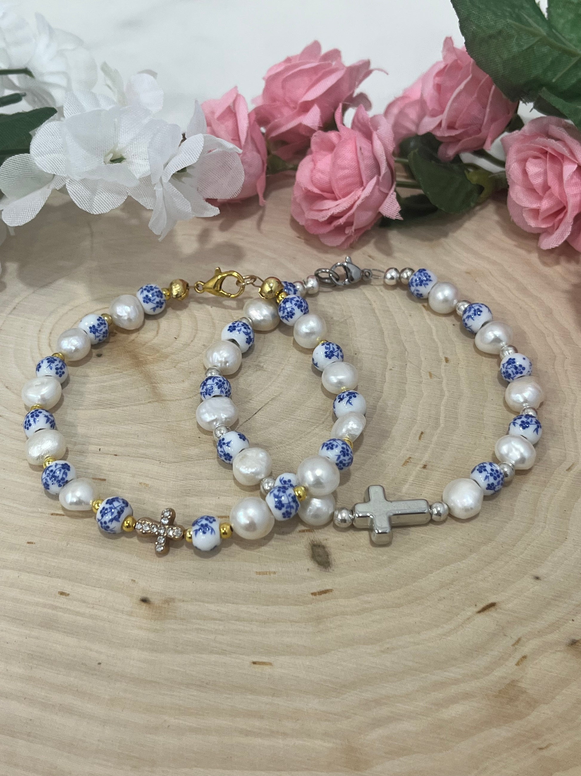 Handmade floral pearl cross bead bracelet with freshwater pearls and cross charm.