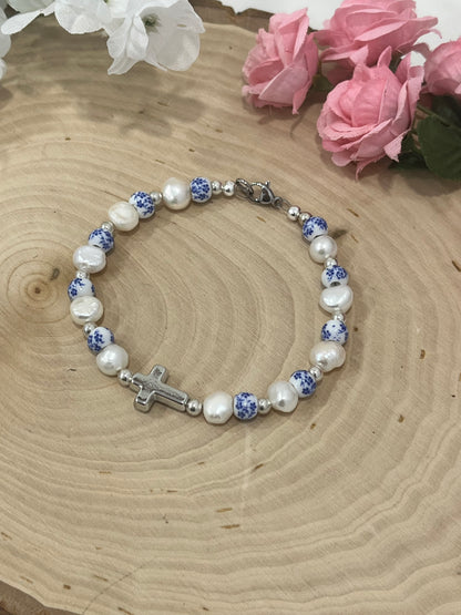 Handmade floral pearl cross bead bracelet with freshwater pearls and cross charm.