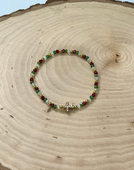 Christmas cross bracelet with red and green crystal beads and gold cross charm.